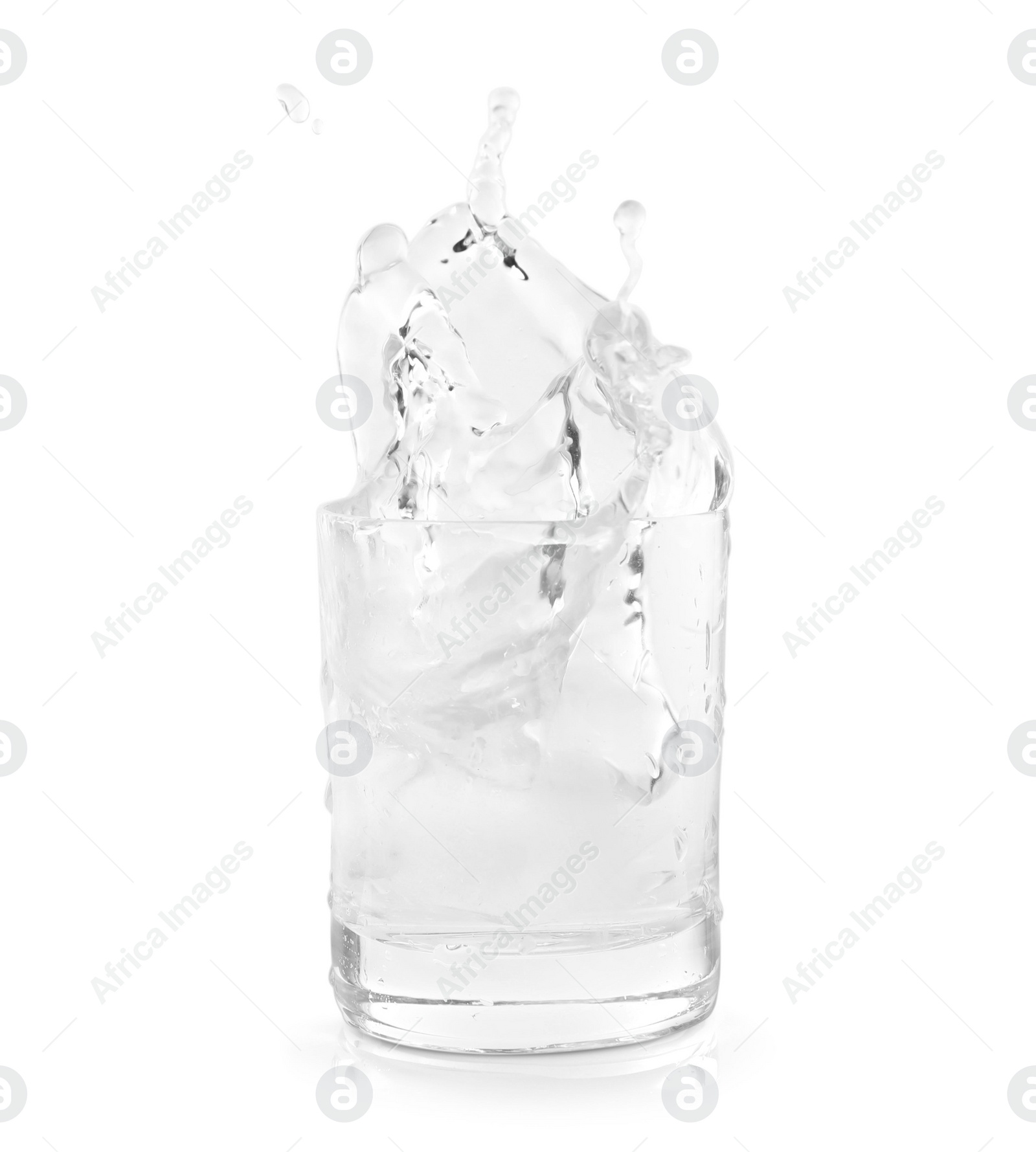 Photo of Shot of vodka with ice and splash isolated on white