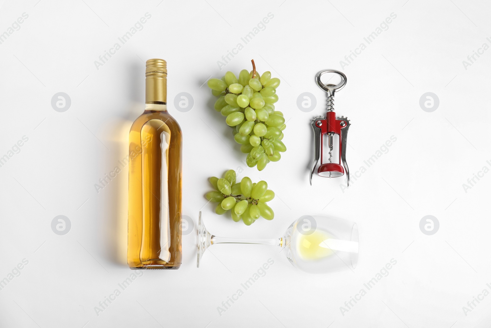 Photo of Composition with wine and grape on white background, top view