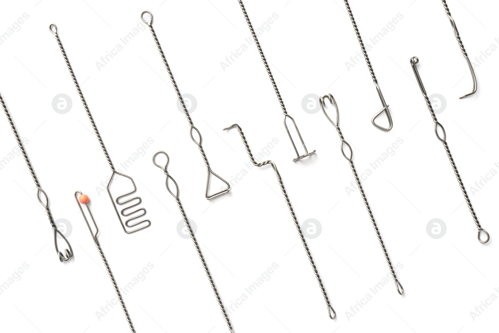 Photo of Set of logopedic probes on white background, top view. Speech therapist's tools