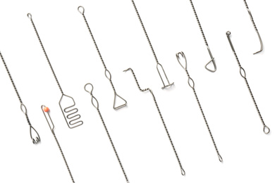 Photo of Set of logopedic probes on white background, top view. Speech therapist's tools