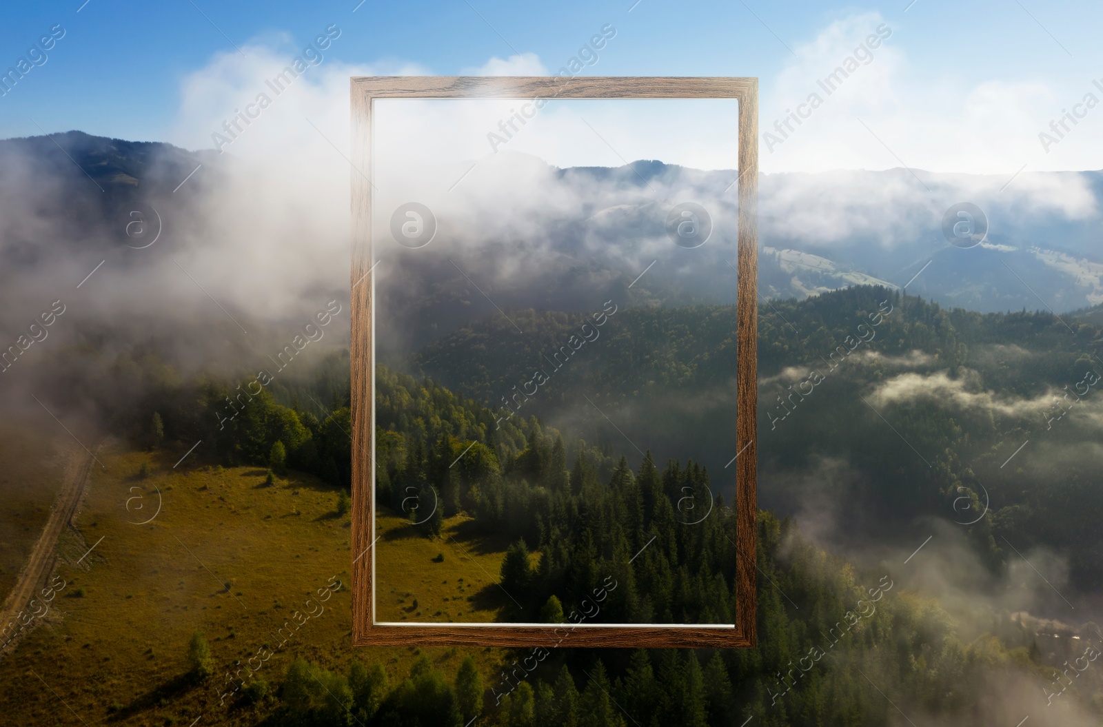 Image of Wooden frame and beautiful mountains with fog in morning