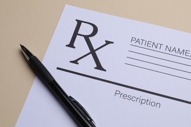 Photo of Medical prescription form and pen on beige background, closeup