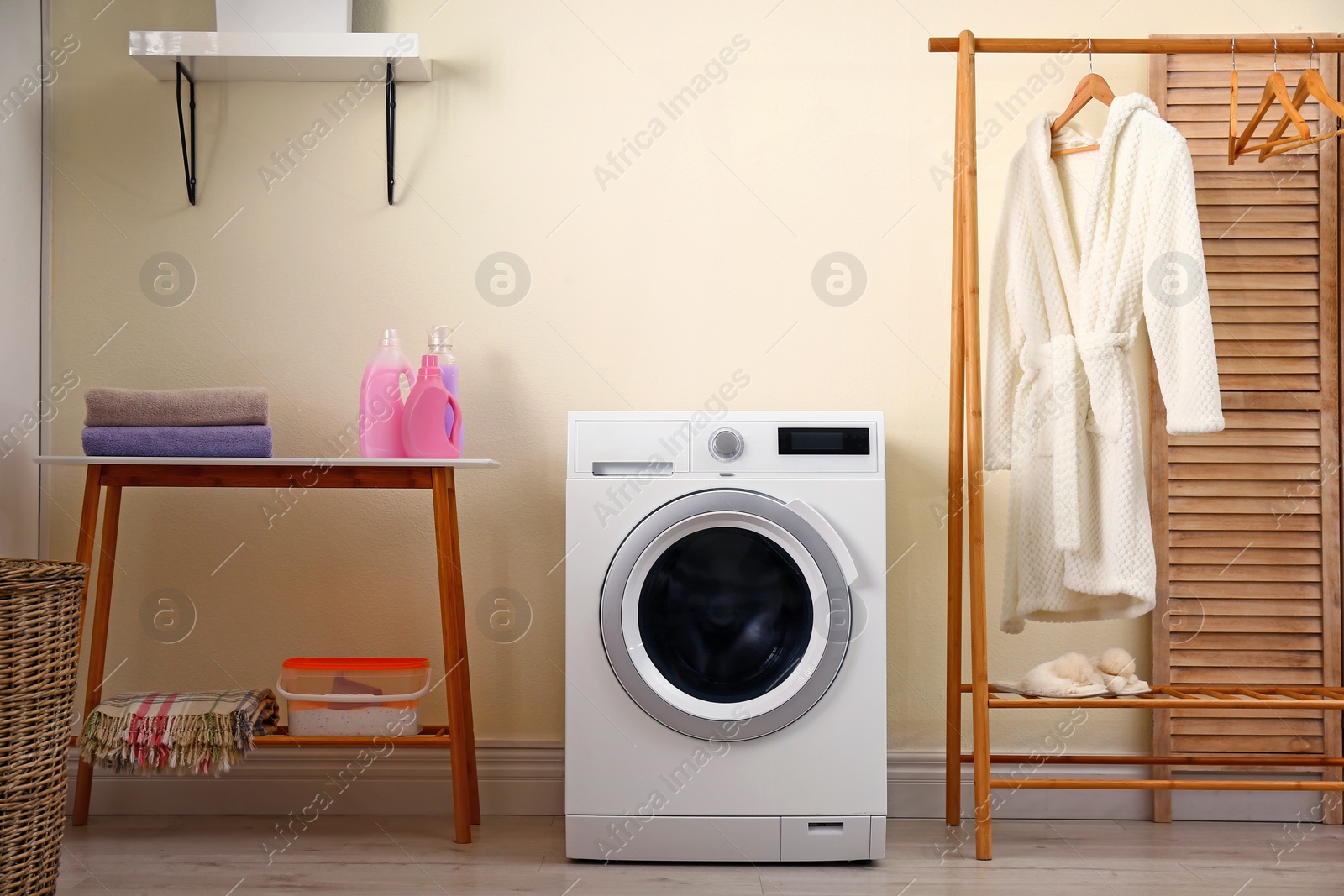 Photo of Laundry room interior with modern washing machine