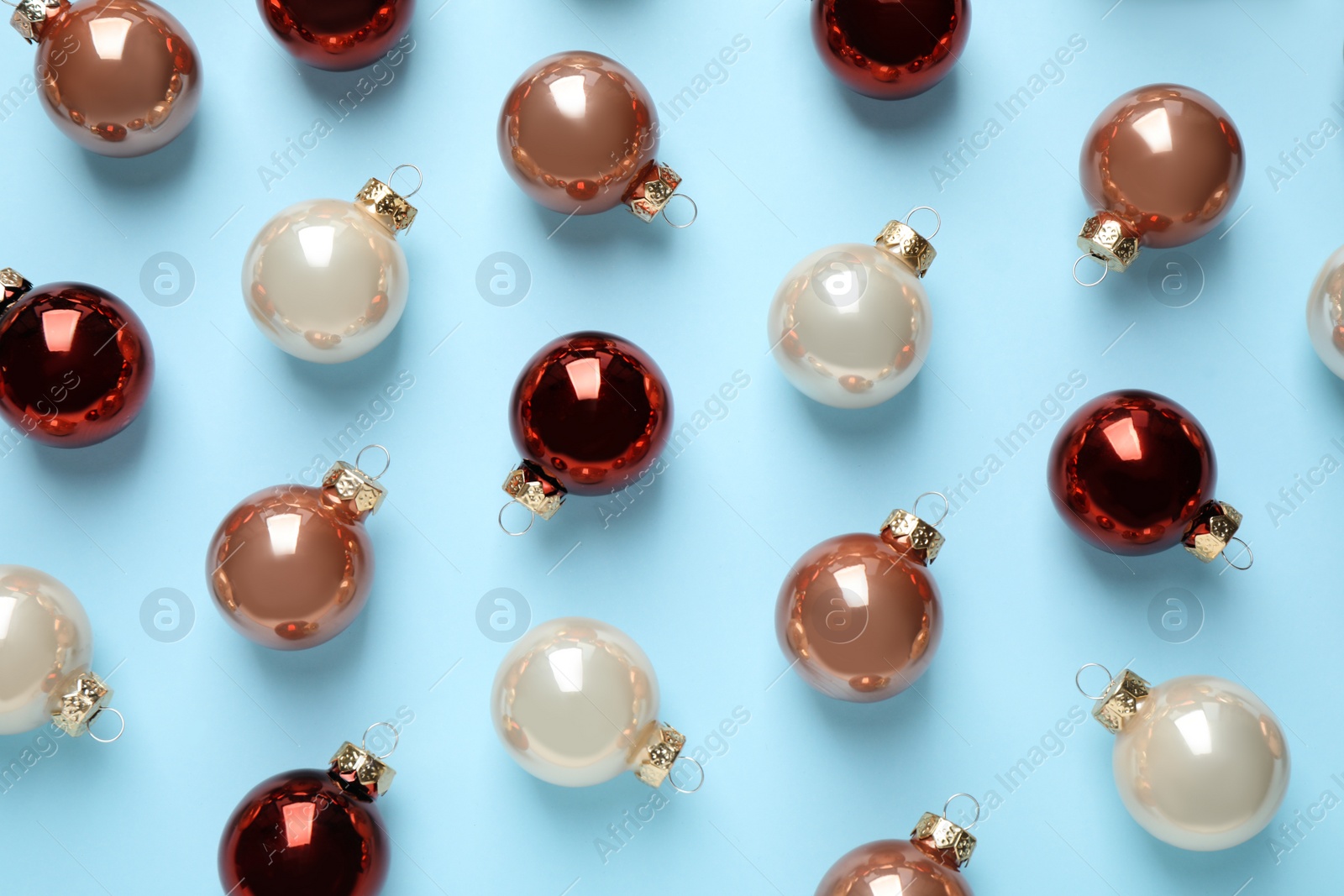 Photo of Flat lay composition with Christmas decorations on light blue background