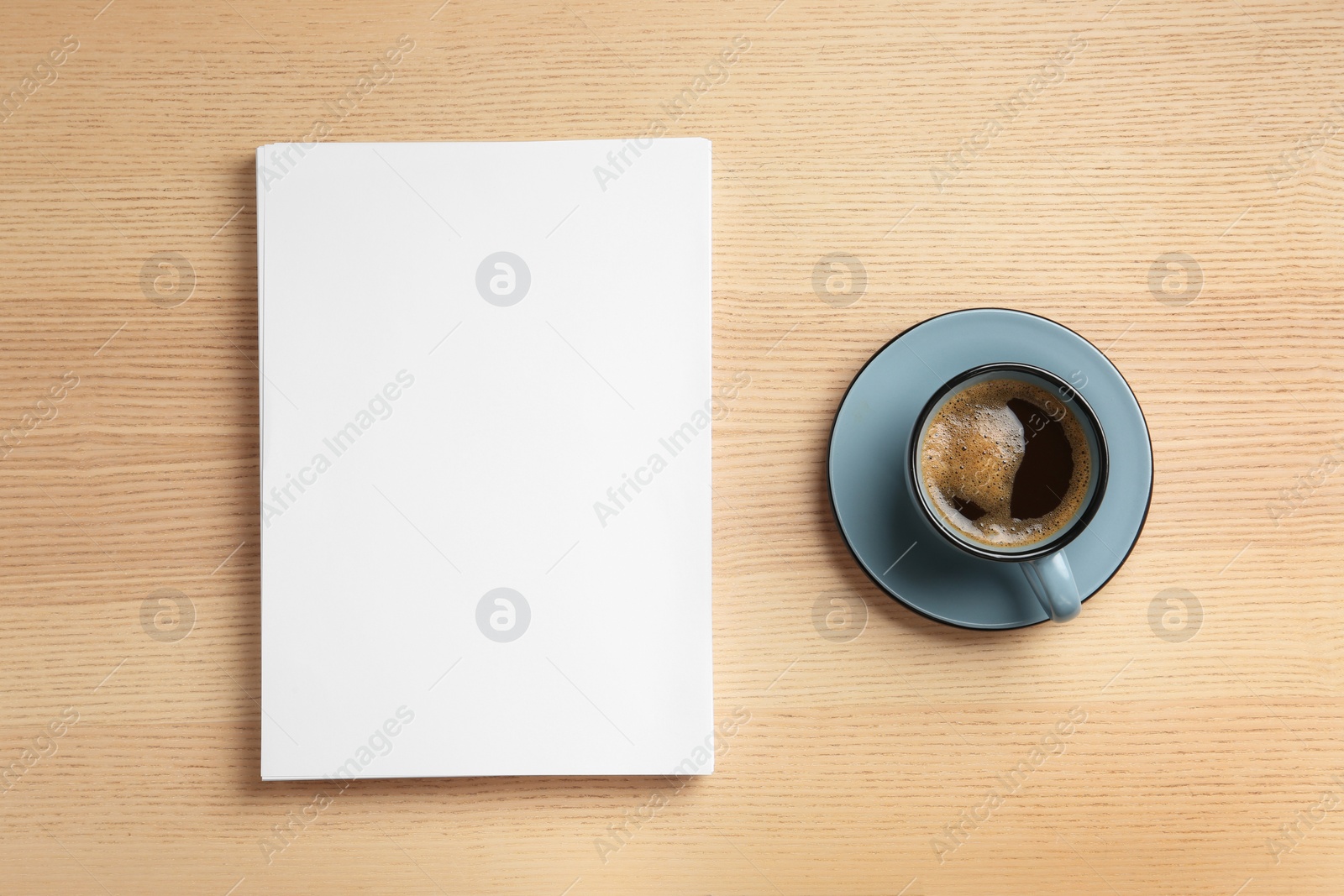 Photo of Blank paper sheets for brochure and cup of coffee on wooden background, flat lay. Mock up