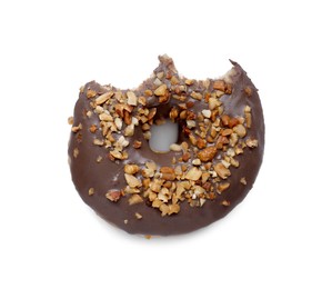 Photo of Tasty bitten glazed donut decorated with nuts isolated on white, top view