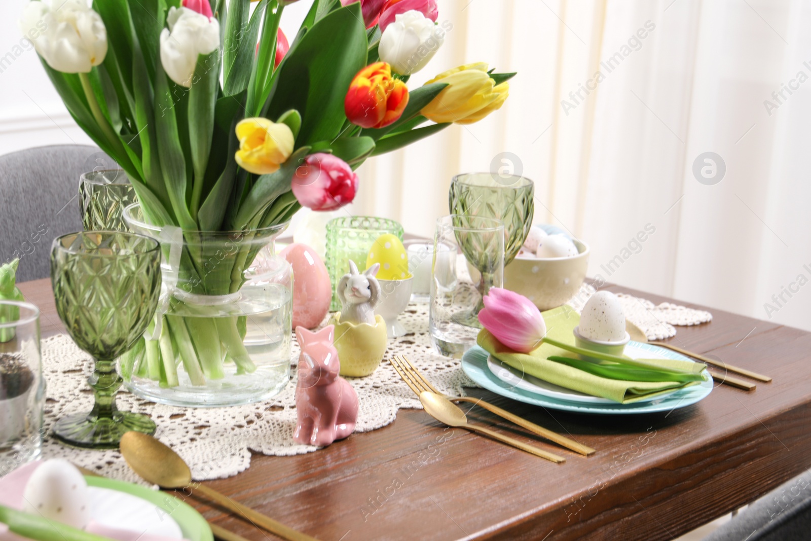 Photo of Festive table setting with beautiful flowers. Easter celebration