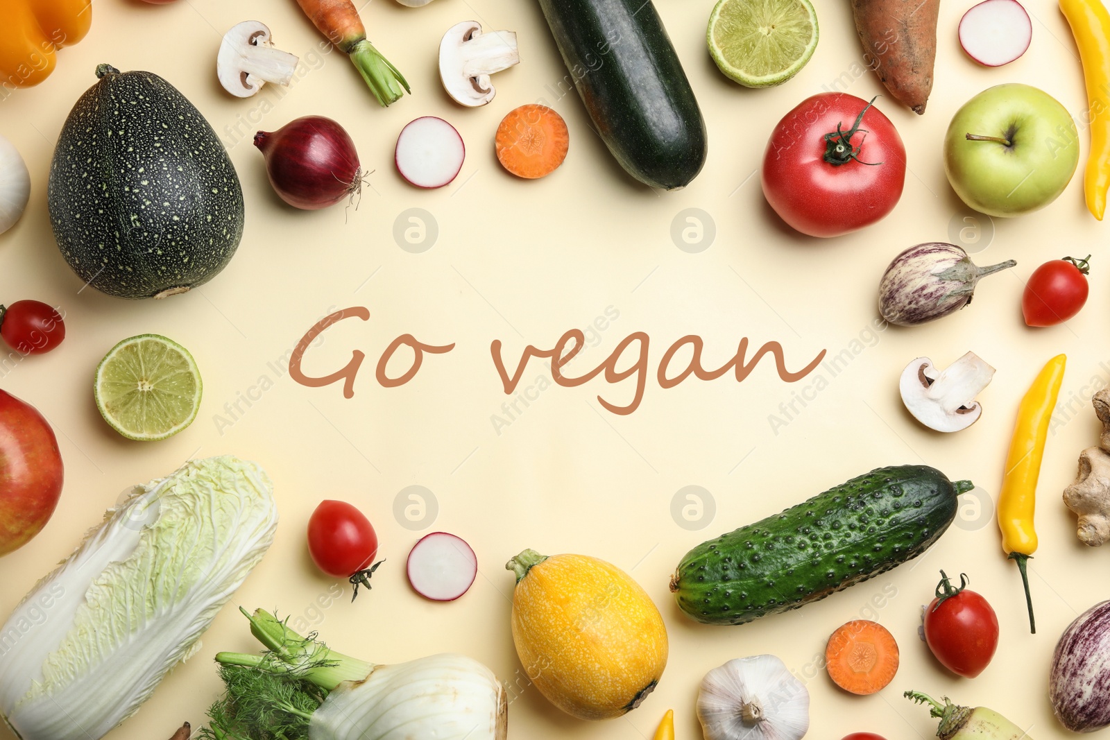 Image of Phrase Go Vegan, fresh vegetables and fruits on beige background, flat lay