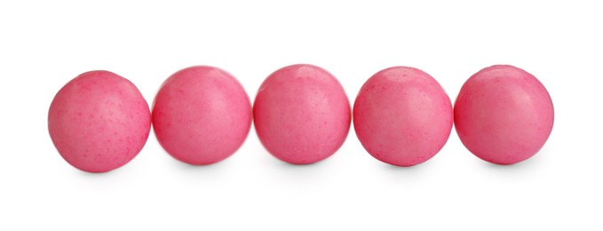Photo of Bright pink chewy gumballs isolated on white