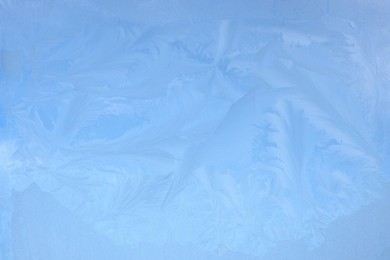 Photo of Beautiful frosty window as background, closeup. Winter morning