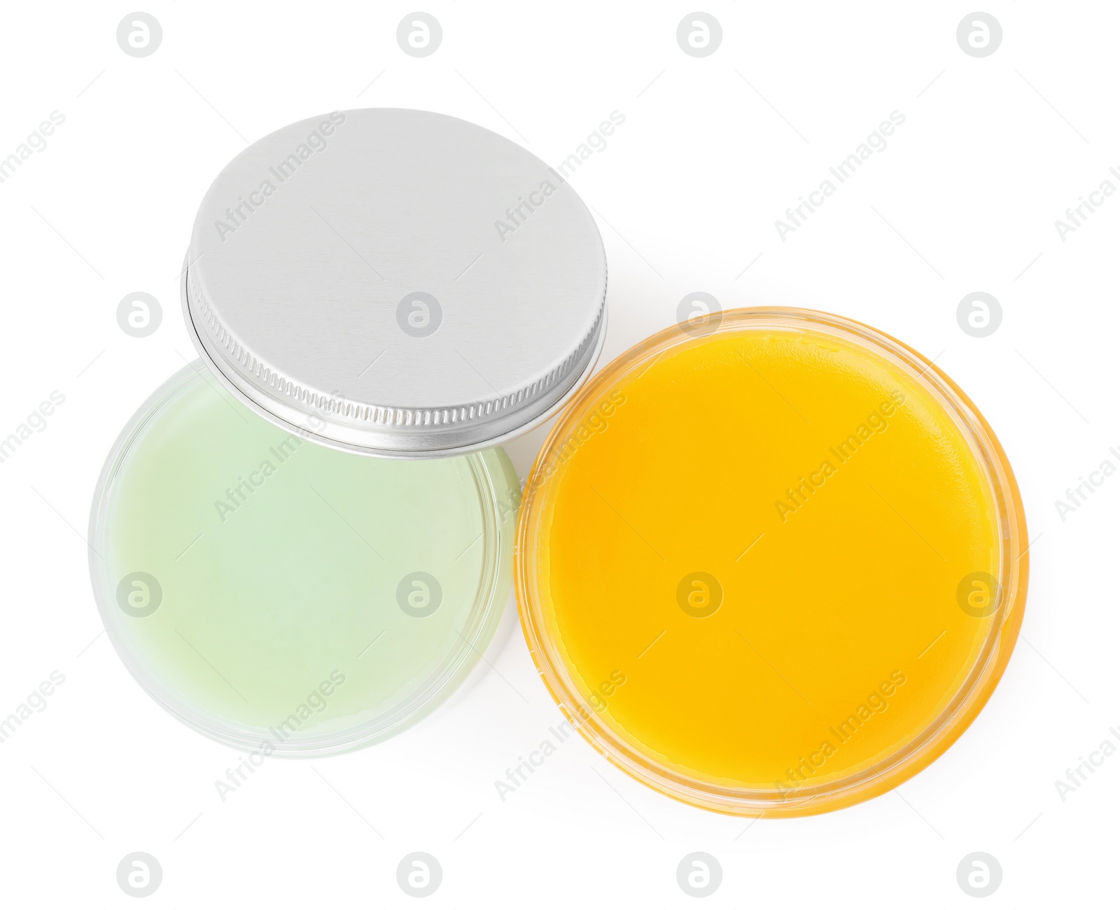 Photo of Jars of cosmetic petrolatum isolated on white, top view