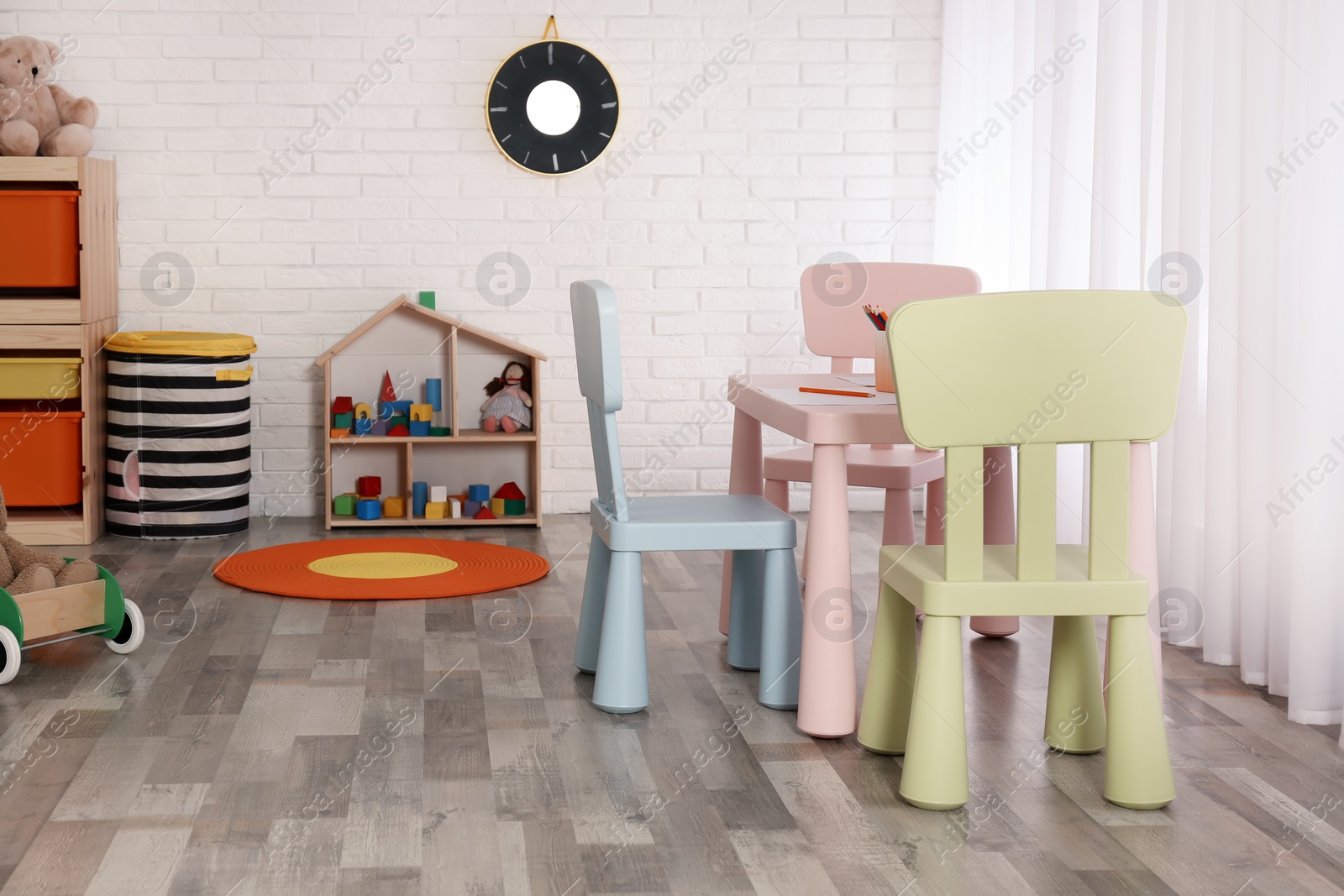 Photo of Modern child room interior with table and chairs