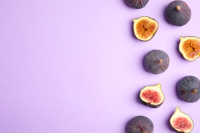 Photo of Delicious ripe figs on violet background, flat lay. Space for text