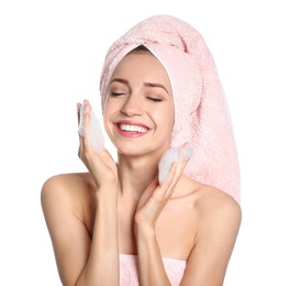 Young woman washing face with soap foam on white background