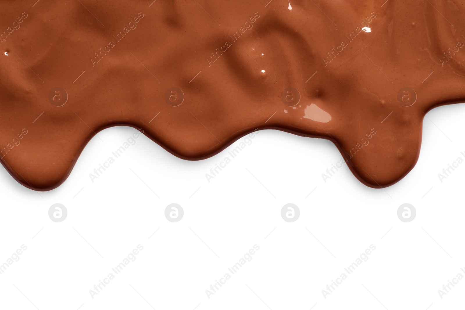 Photo of Tasty melted milk chocolate pouring down on white background