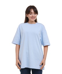 Smiling woman in stylish light blue t-shirt on white background