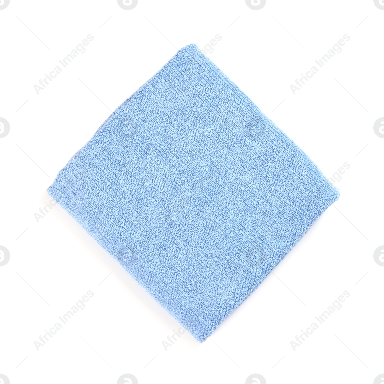 Photo of Light blue soft terry towel isolated on white, top view