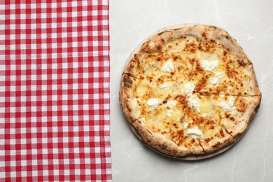 Tasty cheese pizza on light marble table, top view. Space for text