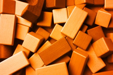 Image of Orange wooden construction set as background, top view