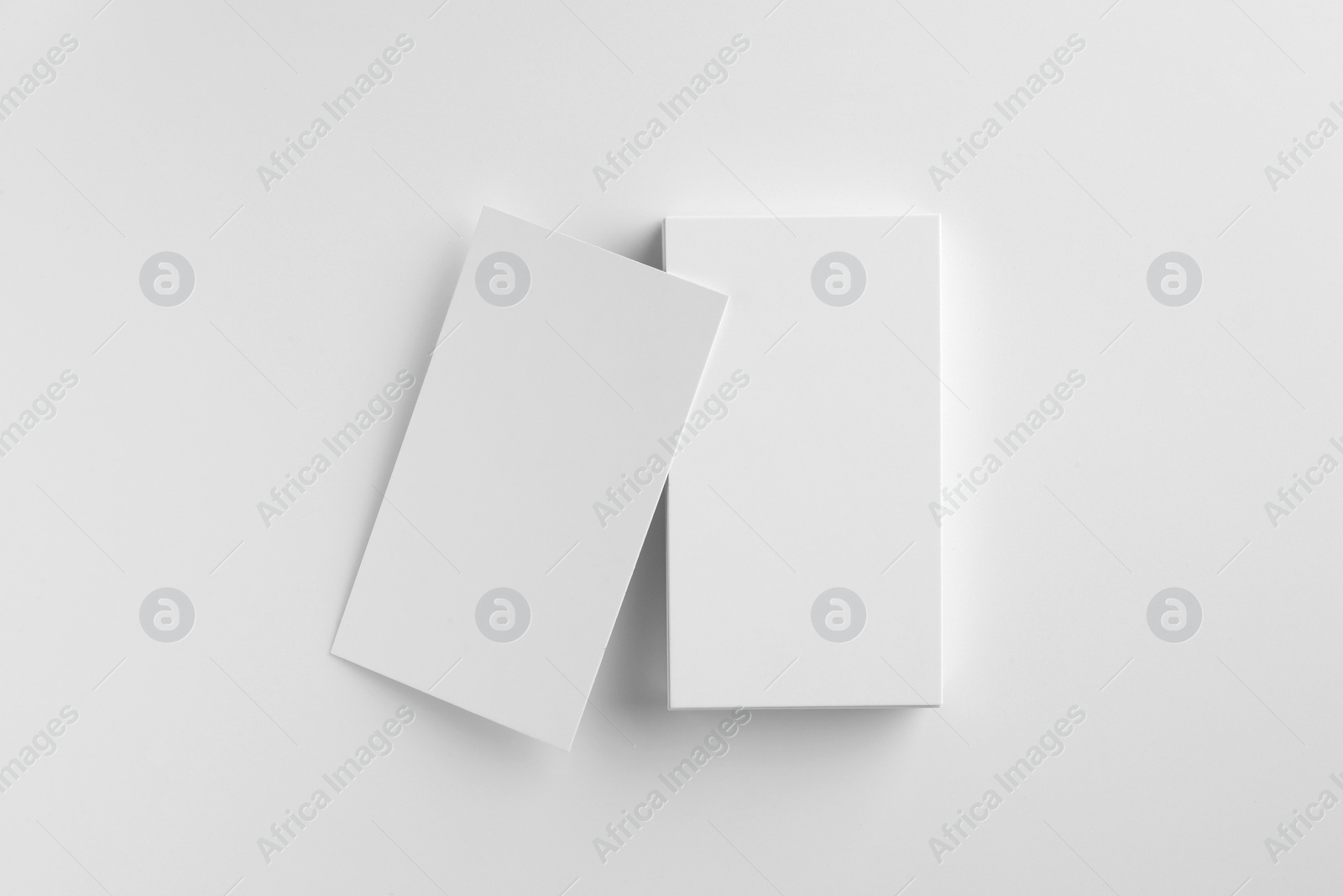 Photo of Blank business cards on white background, top view. Mockup for design