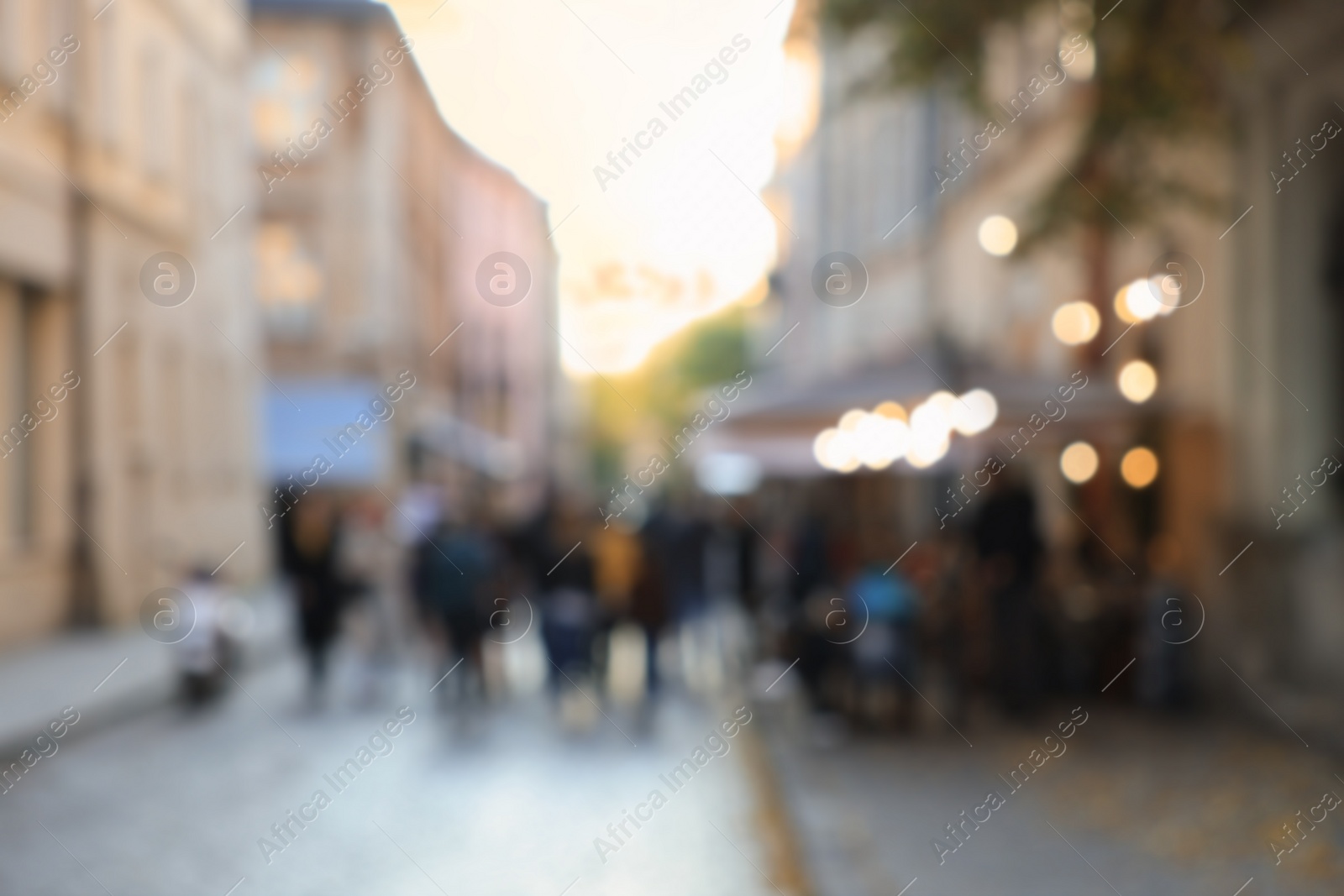 Photo of Blurred view of people walking on city street