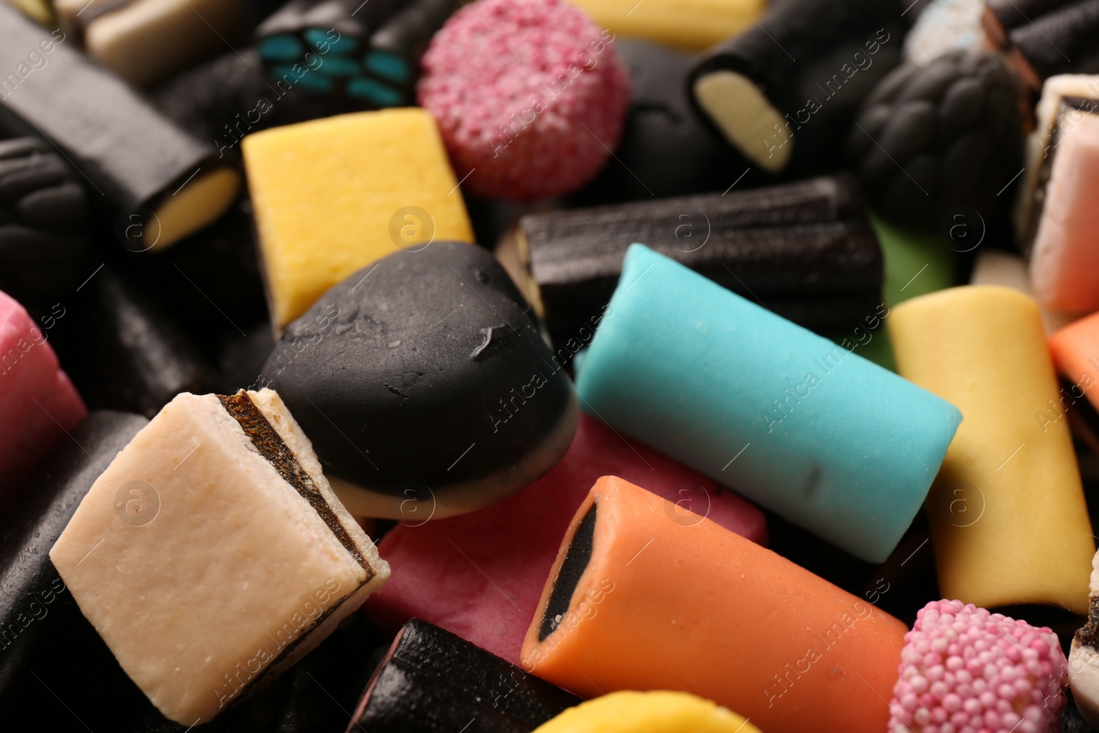 Photo of Many different liquorice candies as background, closeup