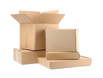 Photo of Pile of cardboard boxes on white background