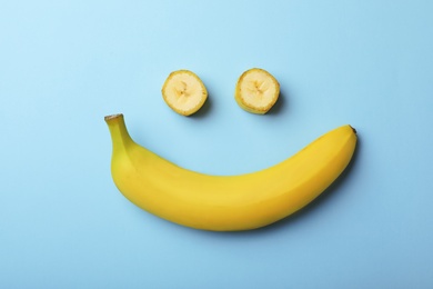 Photo of Funny flat lay composition with bananas on color background