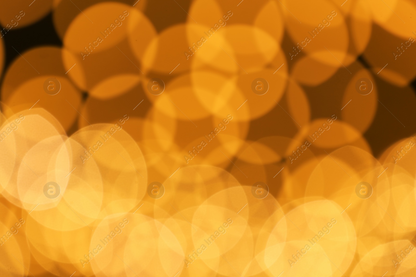 Photo of Beautiful golden lights as background. Bokeh effect