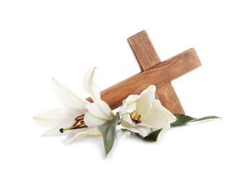 Photo of Wooden cross and blossom lilies on white background