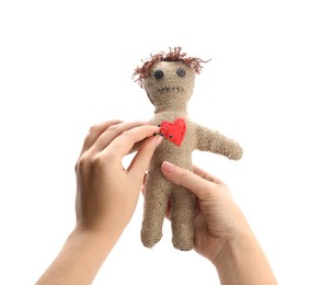 Photo of Woman stabbing voodoo doll with pin on white background, closeup