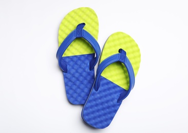 Pair of flip flops on white background, top view. Beach accessories