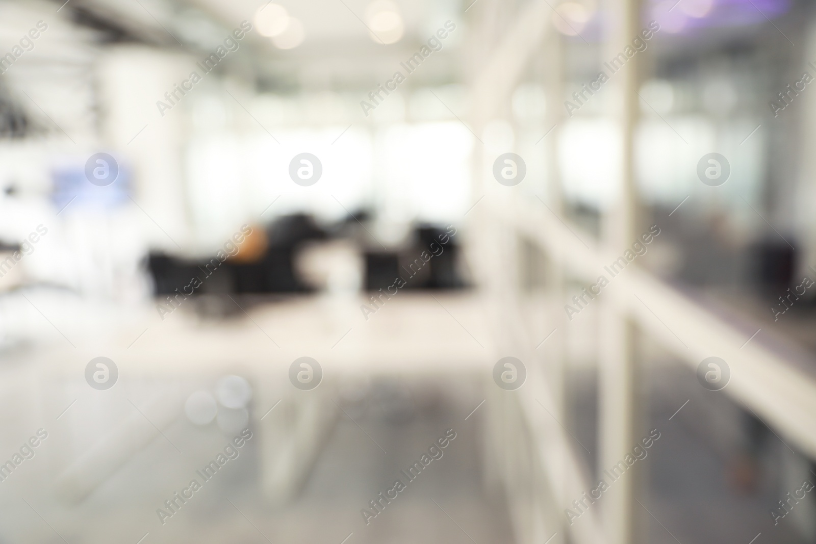 Photo of Blurred view of cozy workspaces with tables and chairs in office