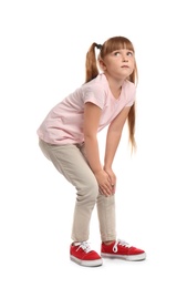 Photo of Full length portrait of little girl having knee problems on white background
