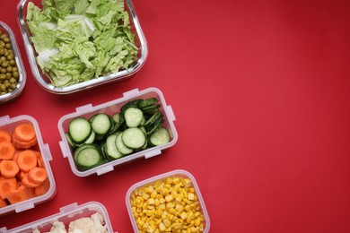 Photo of Plastic and glass containers with different fresh products on red background, flat lay. Space for text