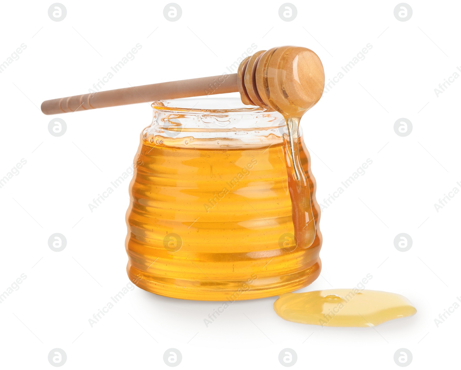 Photo of Tasty honey in glass jar and dipper isolated on white