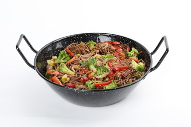 Stir-fry. Tasty noodles with meat and vegetables in wok on white background