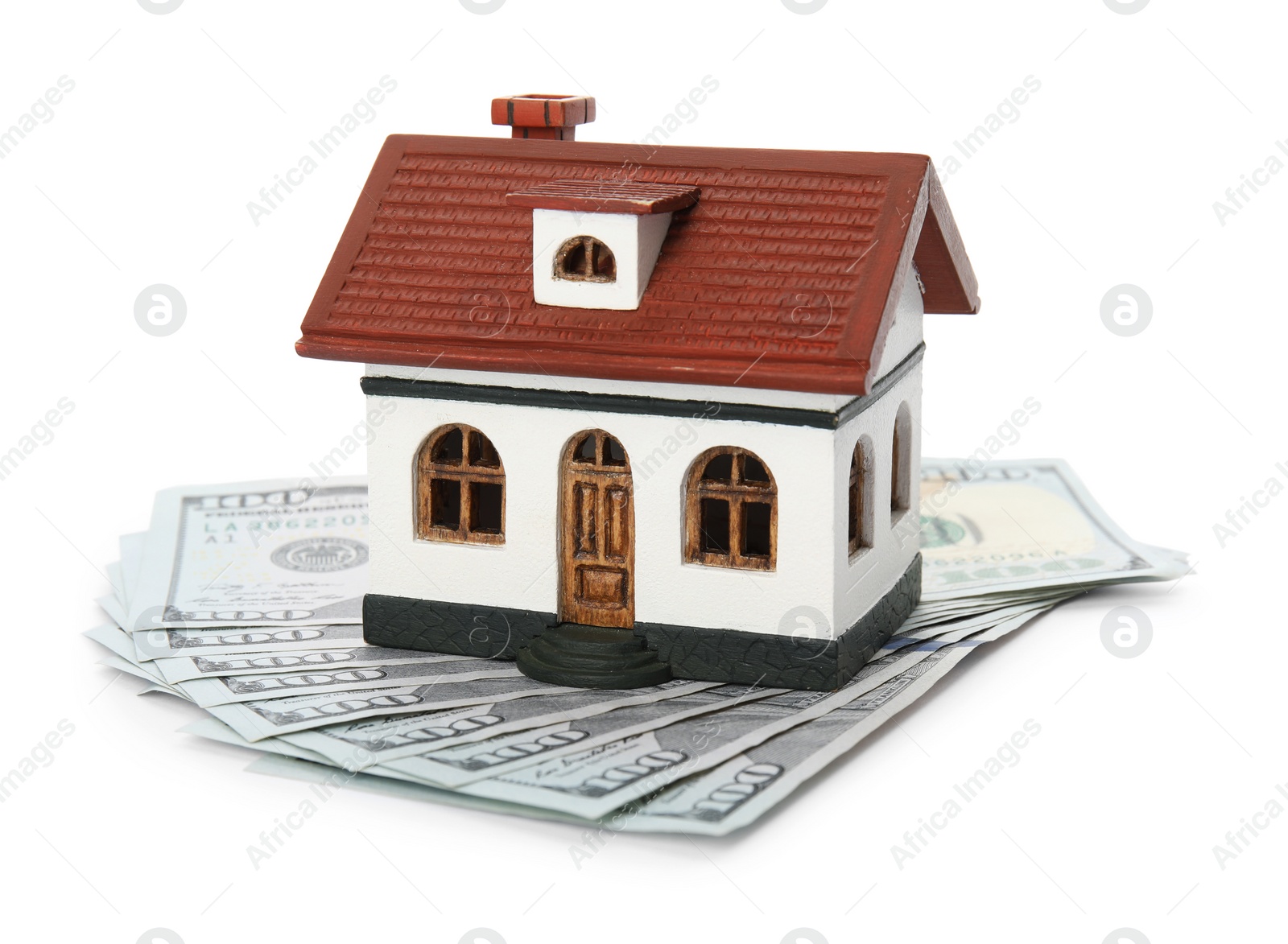 Photo of House model with money on white background