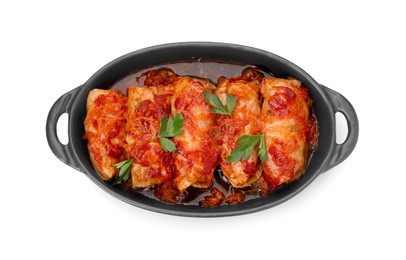Photo of Baking dish of delicious stuffed cabbage rolls cooked with homemade tomato sauce isolated on white, top view