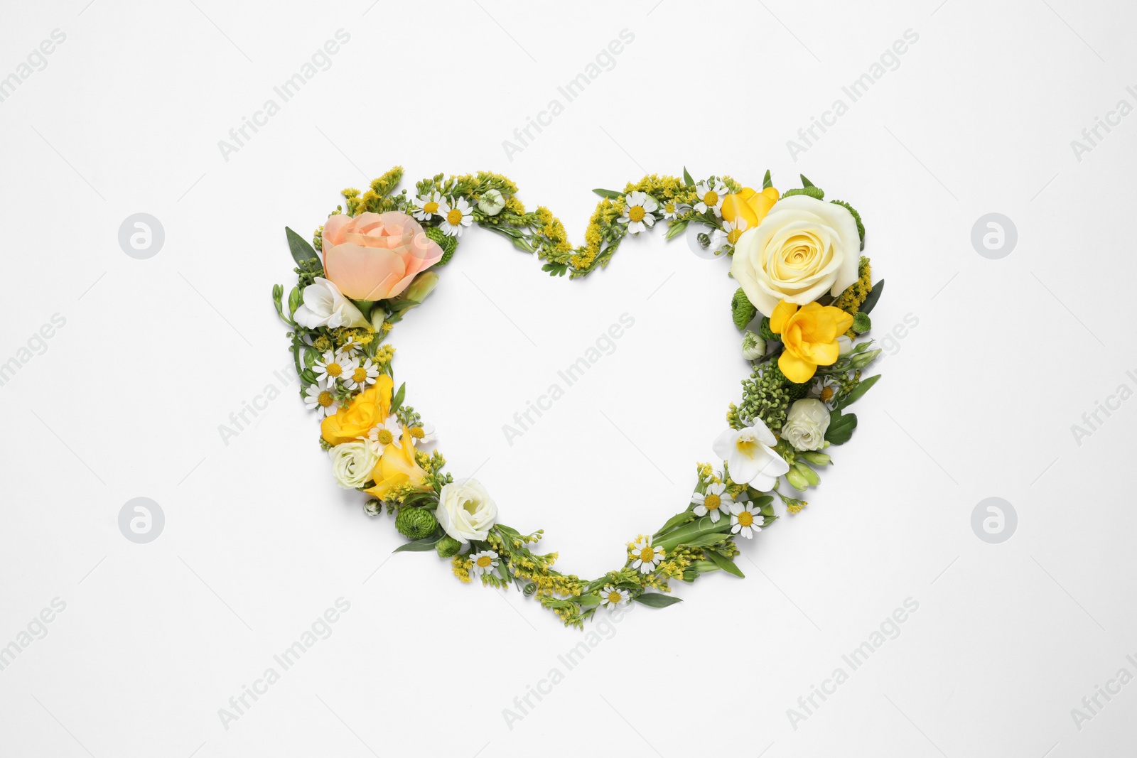 Photo of Beautiful heart made of different flowers on white background, top view