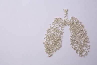 Human lungs made of beads on white background, flat lay. Space for text
