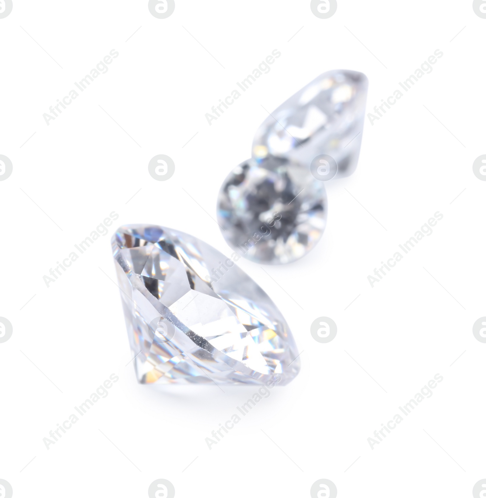 Photo of Different beautiful shiny diamonds isolated on white