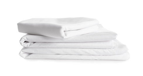 Stack of clean bed linen isolated on white