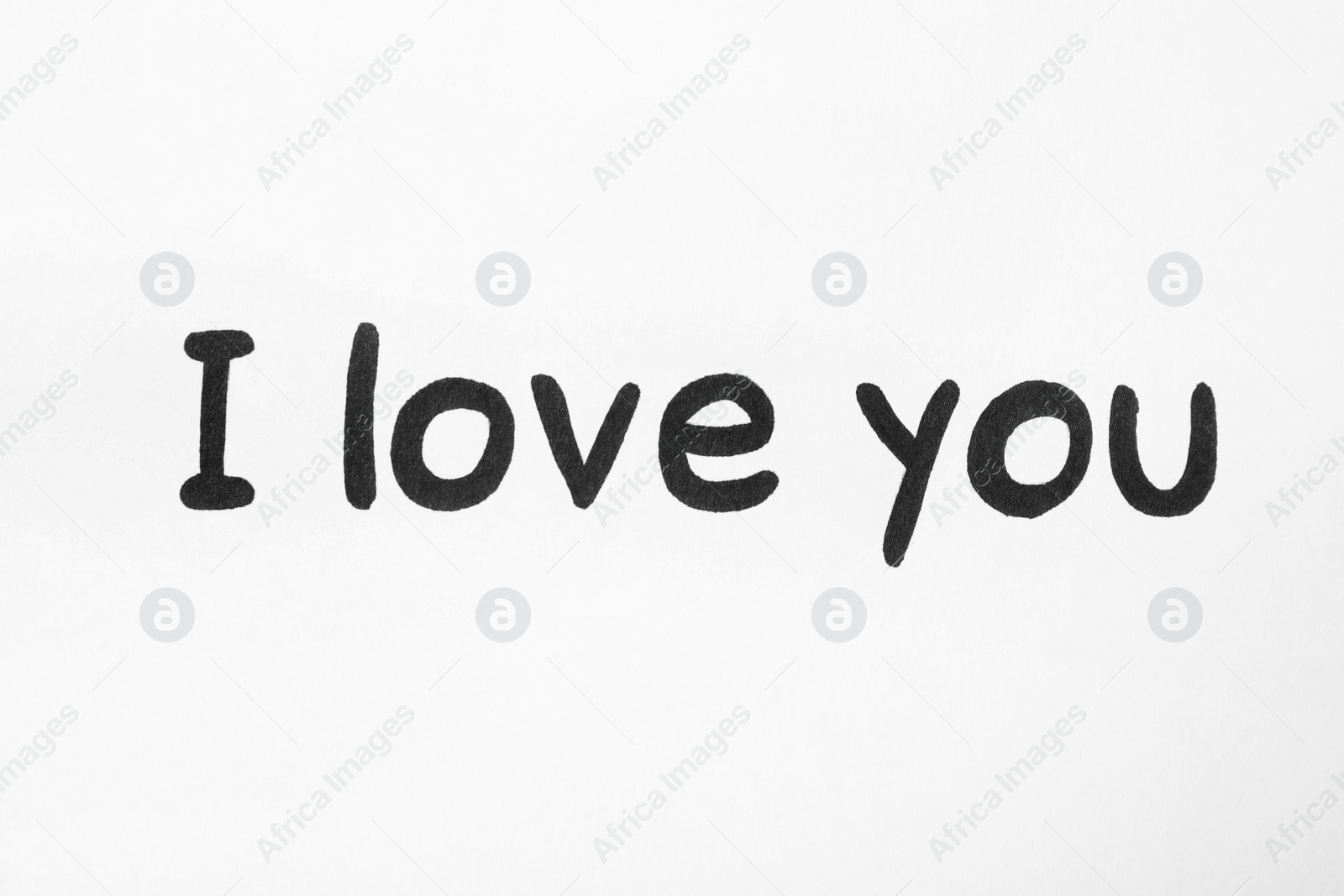 Photo of Handwritten text I Love You on white background