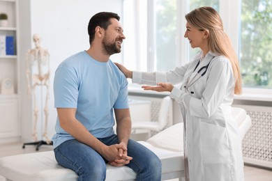 Photo of Professional doctor working with patient in hospital