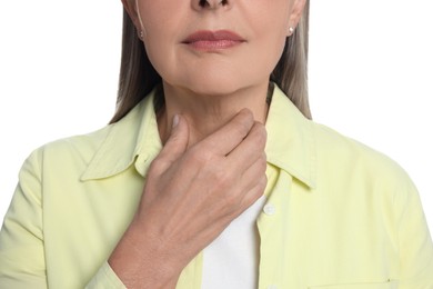 Endocrine system. Senior woman doing thyroid self examination on white background, closeup