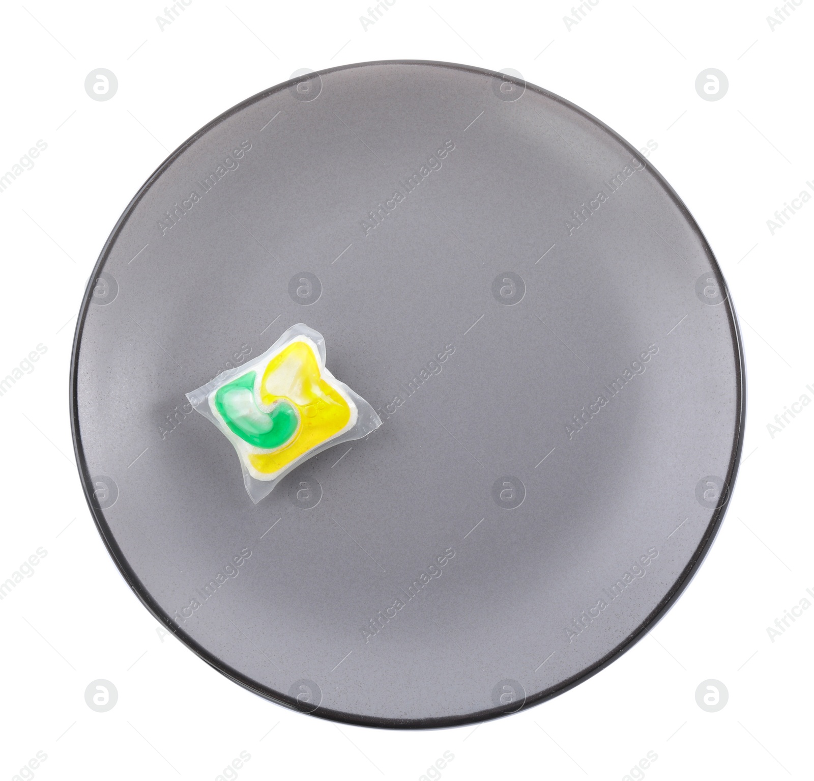 Photo of Grey plate with dishwasher detergent pod on white background, top view