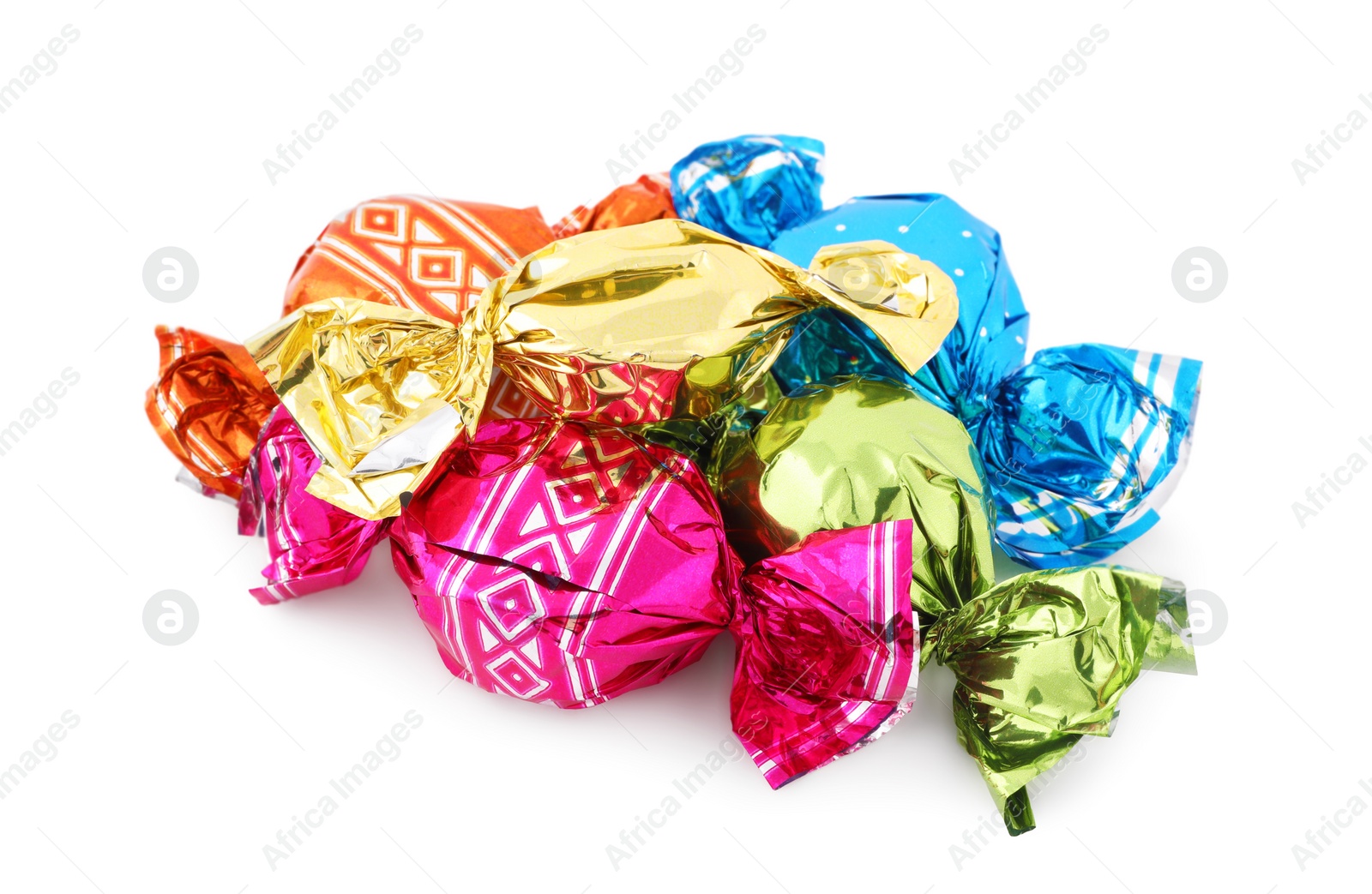 Photo of Pile of sweet candies in colorful wrappers on white background