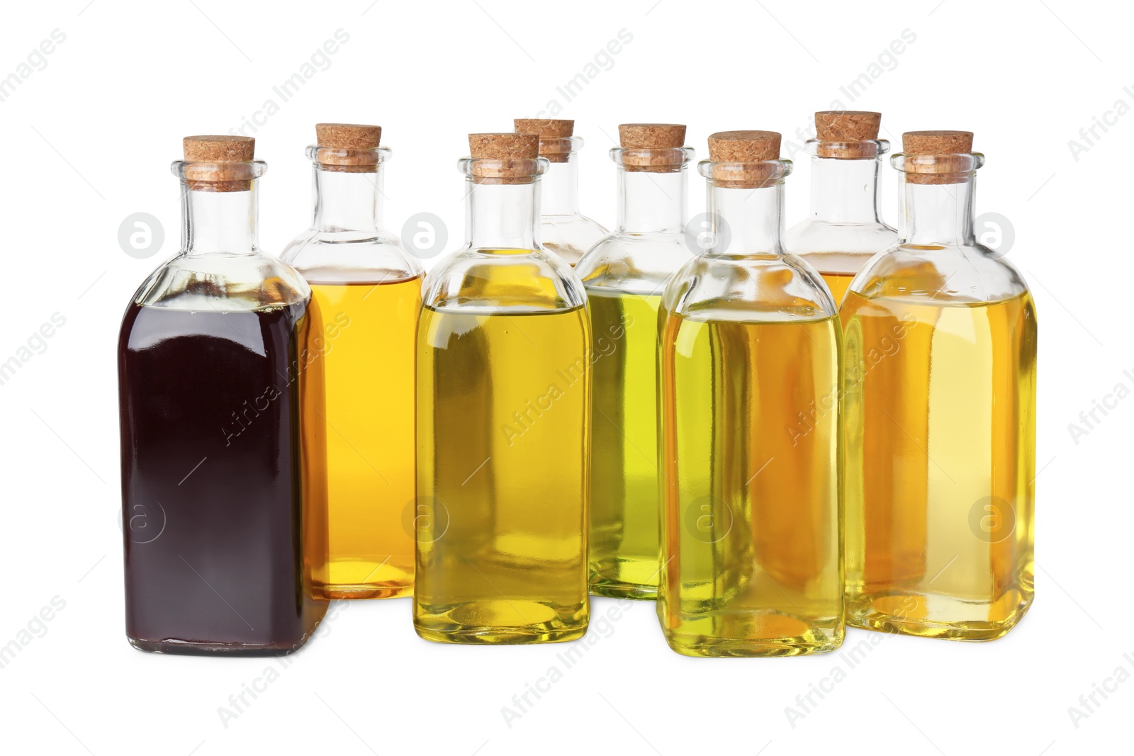 Photo of Vegetable fats. Bottles of different cooking oils isolated on white