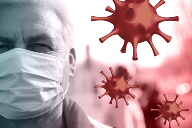 Senior man wearing medical mask outdoors during coronavirus outbreak